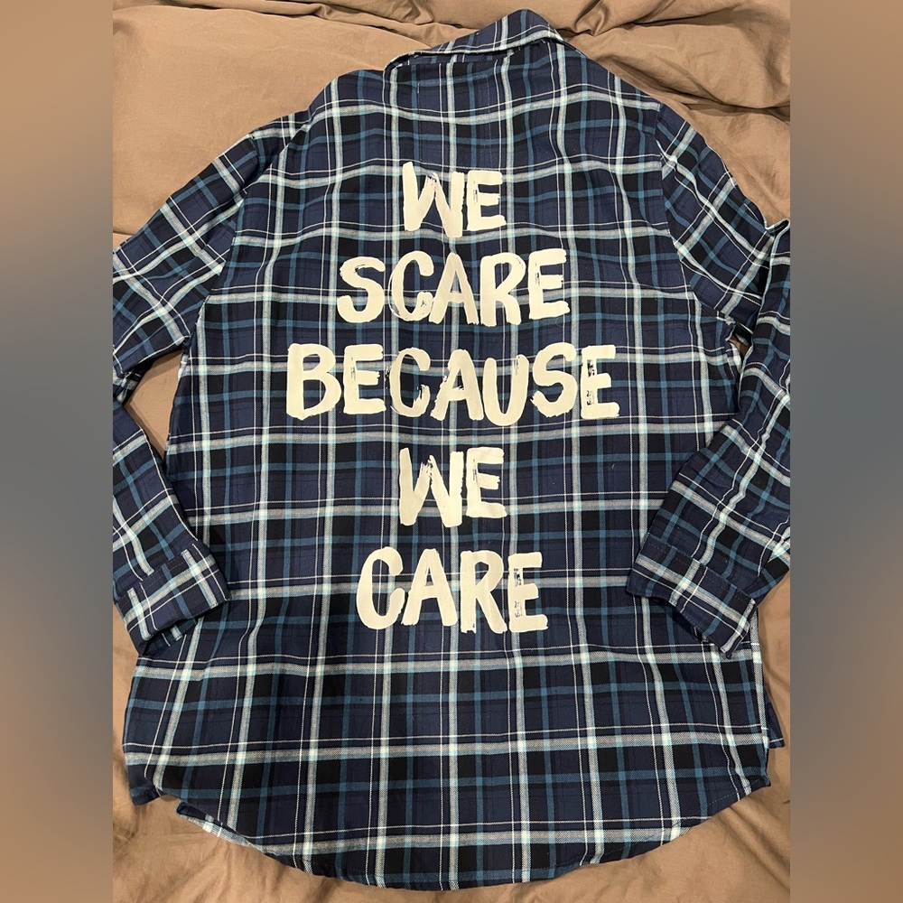 Disney Cakeworthy plaid Monsters Inc. we scare because we care Shirt
